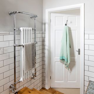 bathroom with white door and hanging towel