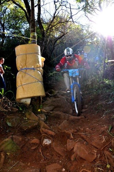 A rider negotiates a rock garden racing downhill in South Africa