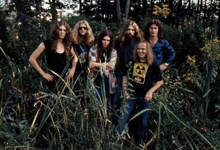 Lynyrd Skynyrd standing in a swamp in 1974