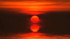 A sunset over a river in Thailand.
