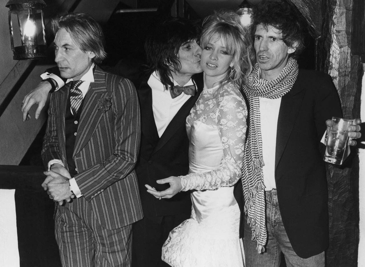 Ronnie Wood celebrates with Charlie Watts and Keith Richards in Gerrards Cross, Buckinghamshire, after his wedding to girlfriend Jo Howard.