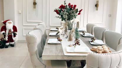 neutral dining room with wooden table and wall panelling and dining chairs
