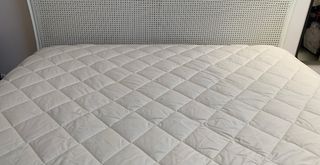 Bed with Woolroom Deluxe Washable Mattress protector on the mattress