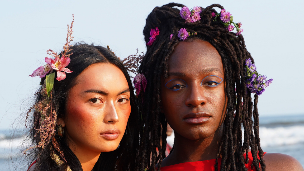 Models at Chromat Show wearing liquid blush and flowers in their hair