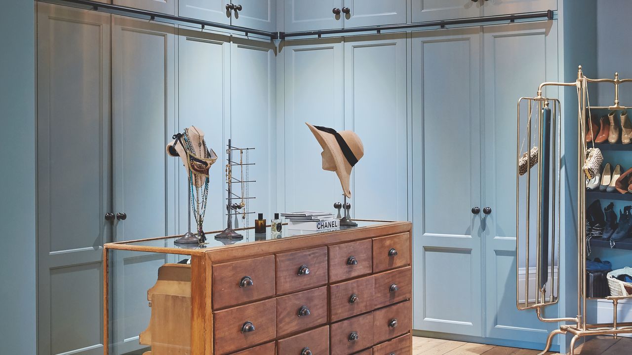 Blue dressing room with wooden island