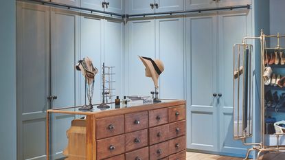 Blue dressing room with wooden island