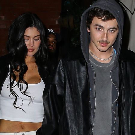 Kylie wears a white tank and timothee wears a hoodie and a leather jacket.