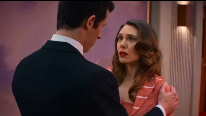 Elizabeth Olsen and Callum Turner looking at each other in Eternity.