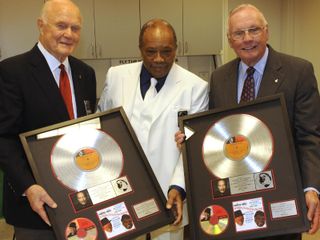 Photo of Neil Armstrong and John Glenn with platinum copies of