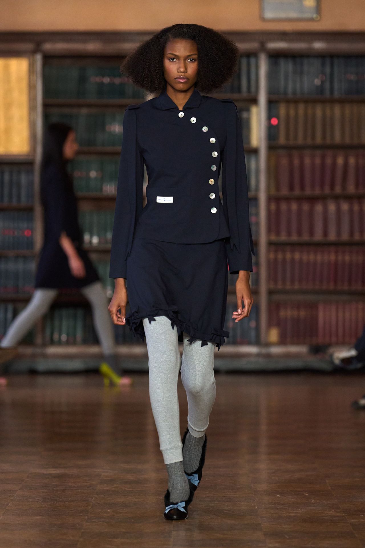 models walk the Sandy Liang Fall 2026 fashion show runway wearing slipper shoes
