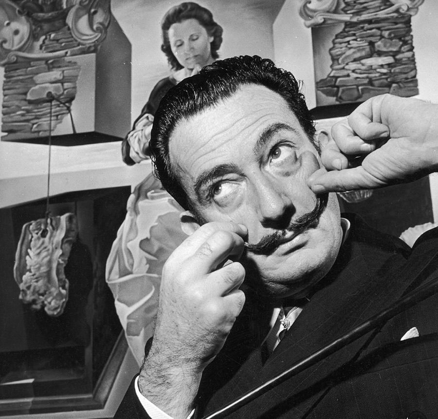 Salvador Dali (1904—1989) in London with one of his paintings in December 1951.