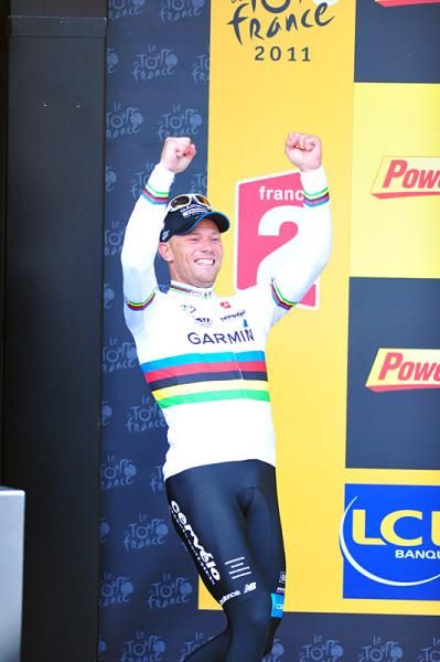 Stage 16 winner Thor Hushovd steps onto the stage for his podium presentation.