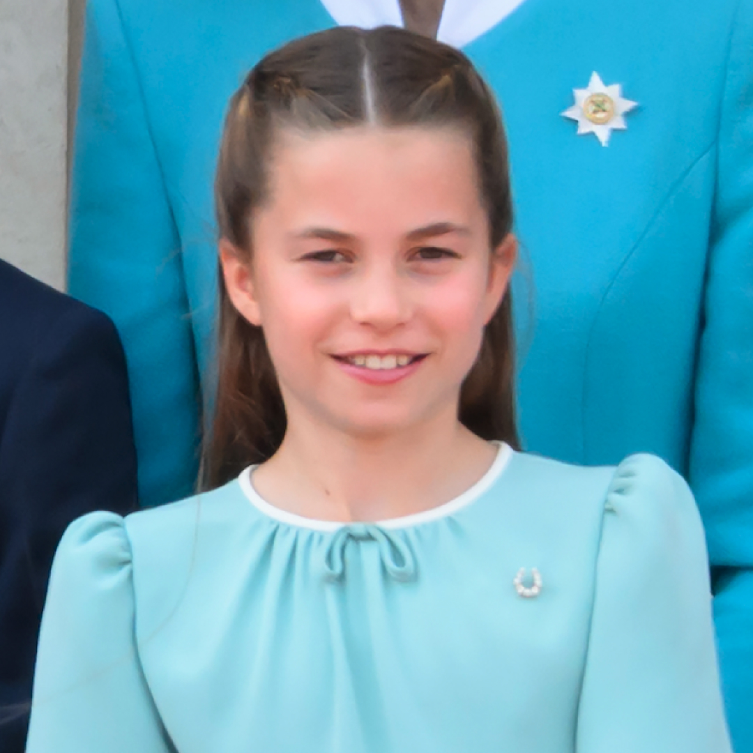Meghan Markle wears a white dress and Prince Harry wears a black suit, as their daughter, Princess Lilibet makes a cameo on Meghan's Instagram account carrying a Jellycat rainbow bag from one of cousin Princess Charlotte's favorite toy brands