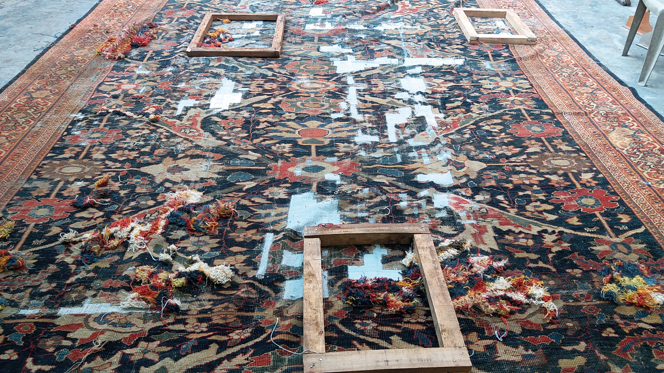 a damaged rug is repiled