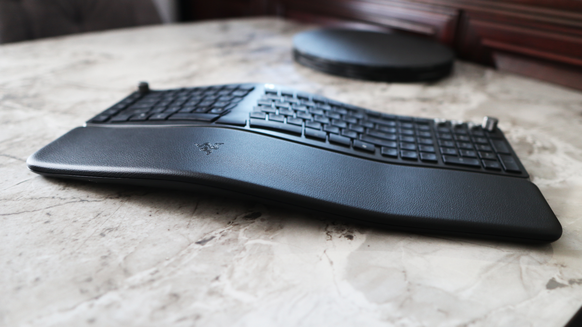 Razer Pro Type Ergo ergonomic keyboard on marble surface