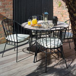 black garden table and chairs set with mosaic table top