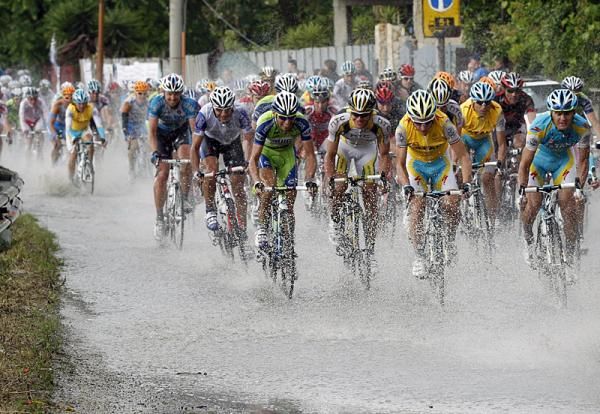 Deep standing water on the course provided an additional challenge to the peloton.