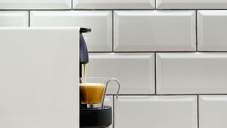 Pod coffee machine against white wall