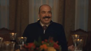 Rick Hoffman smiles at the festive dinner table in Thanksgiving.