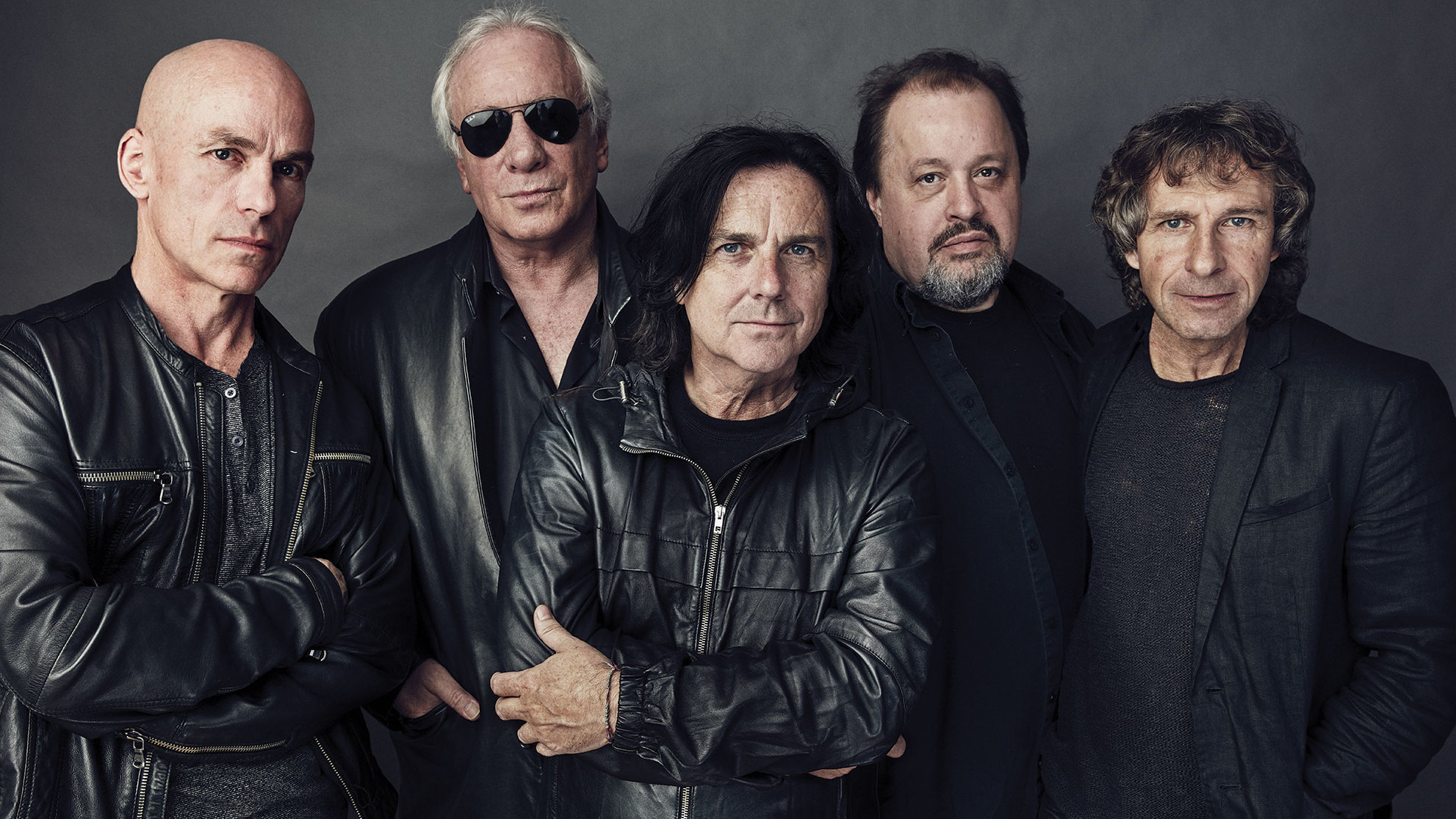 Marillion moody band shot against grey background