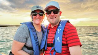 A photo of Jess and Tim Heuermann on a boat in the Galapagos Islands