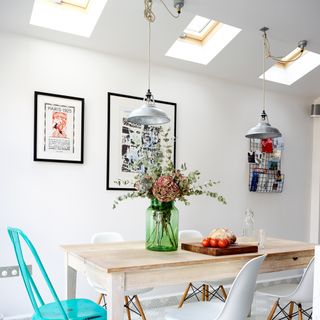 kitchen diner with flower vase and white wall