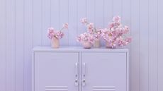 lilac cabinet against a lilac panelled wall 