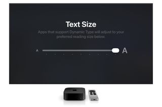 A screenshot showing the new text size feature on Apple TV. An Apple TV and remote sit below the screen.