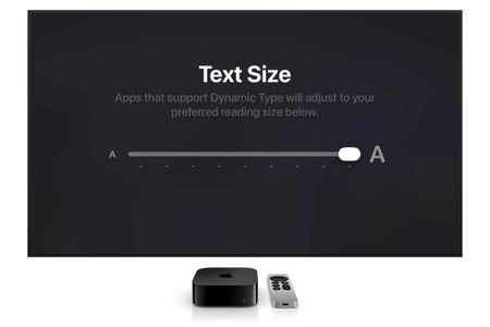 A screenshot showing the new text size feature on Apple TV. An Apple TV and remote sit below the screen.
