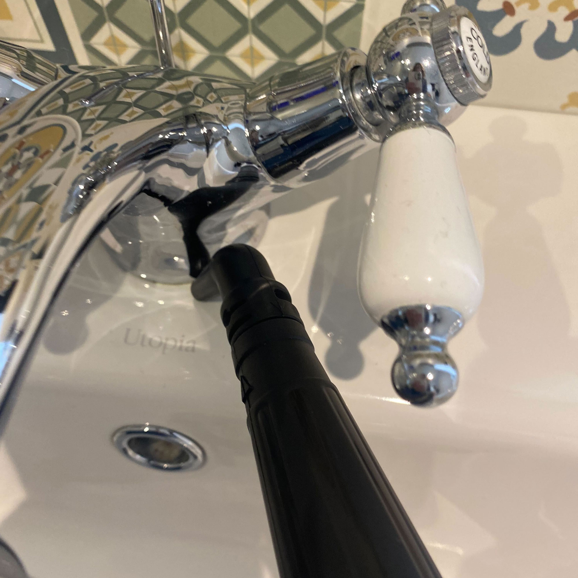 VAX steam fresh total home steam cleaner nozzle on taps at basin in  bathroom