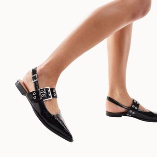 Flat lay image of black flat shoes 