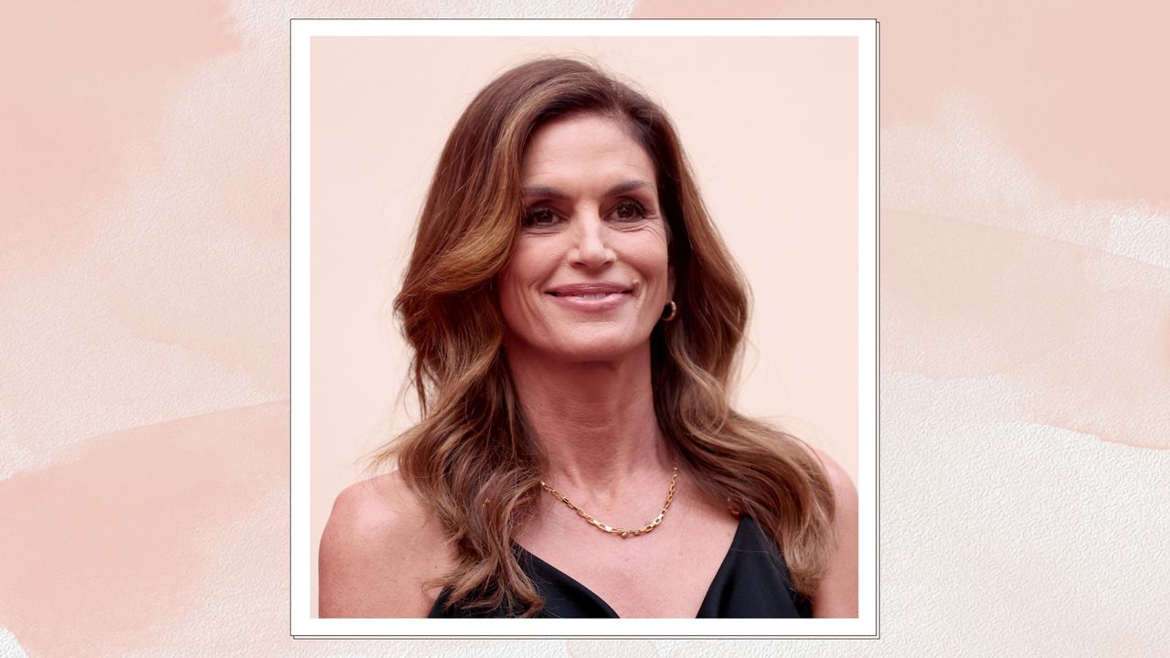 Omega Brand Ambassador Cindy Crawford is pictured with loose waves whilst attending the opening night of OMEGA House Paris 2024 on July 27, 2024 in Paris, France/ in a pink watercolour paint-style template