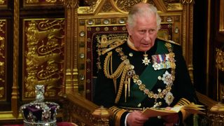 Prince Charles, Prince of Wales reads the Queen's speech next to her Imperial State Crown in the House of Lords Chamber, during the State Opening of Parliament in the House of Lords at the Palace of Westminster on May 10, 2022 in London, England.