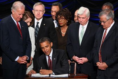 Former President Obama signs the Dodd-Frank Wall Street Reform and Consumer Protection Act in 2010.