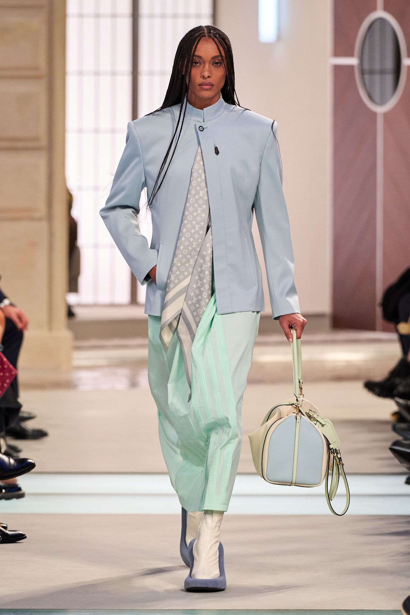 Model wears the baby blue color trend on the runway.