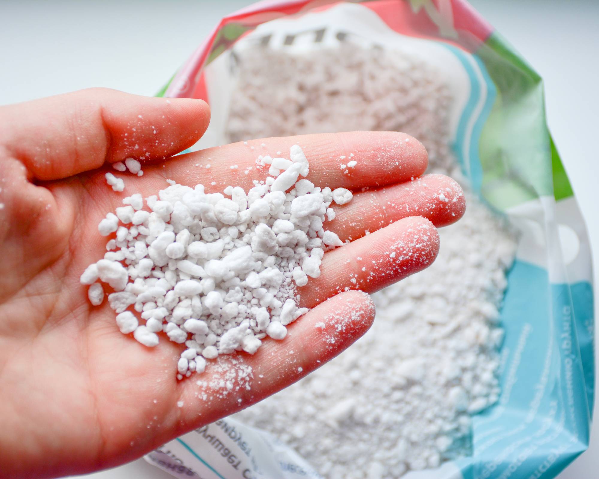 Hand holding perlite