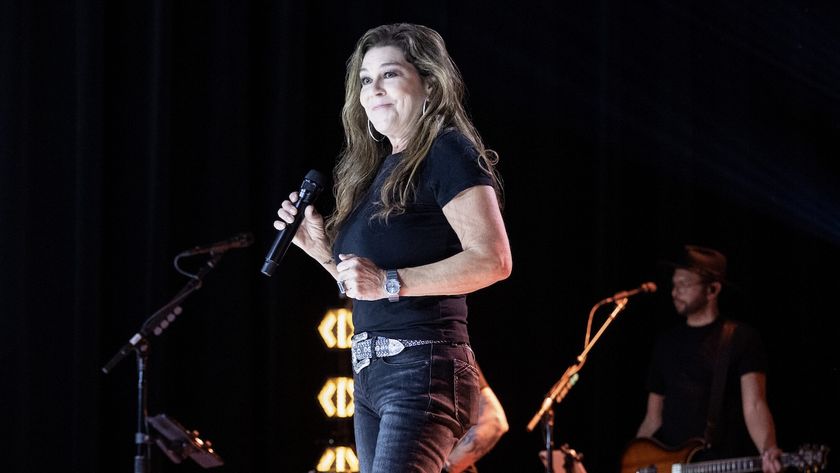 Gretchen Wilson on stage holding a mic for CBS&#039; The Road