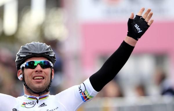 The World Champion raiises his hands after wining stage 2 of the Giro