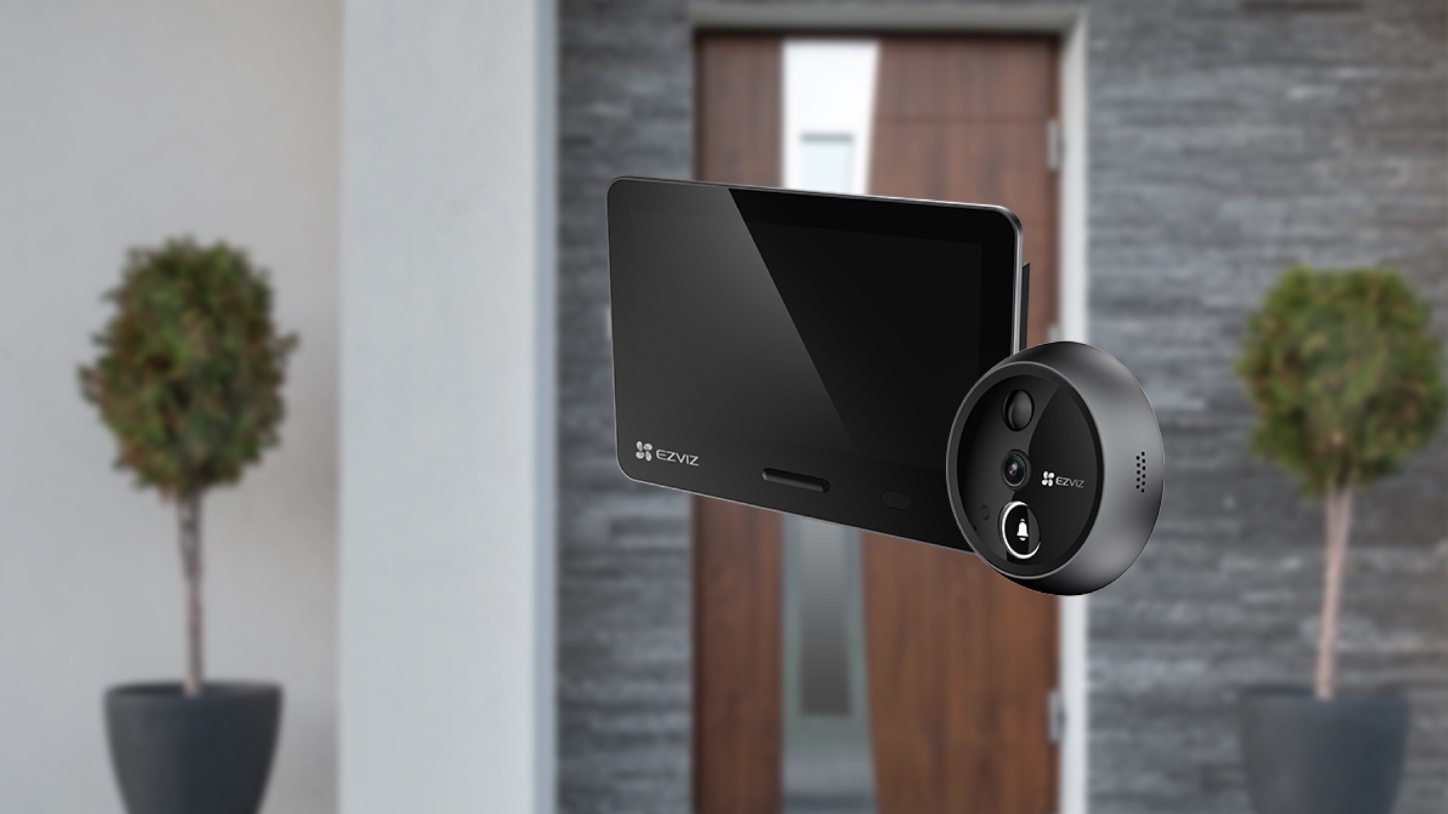 EZVIZ EP4 Door Viewer superimposed on a blurry image of a front door with green pot plants on either side of the door