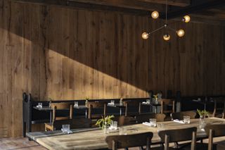 Dining room area with wooden walls at Rooms Hotel Kokhta