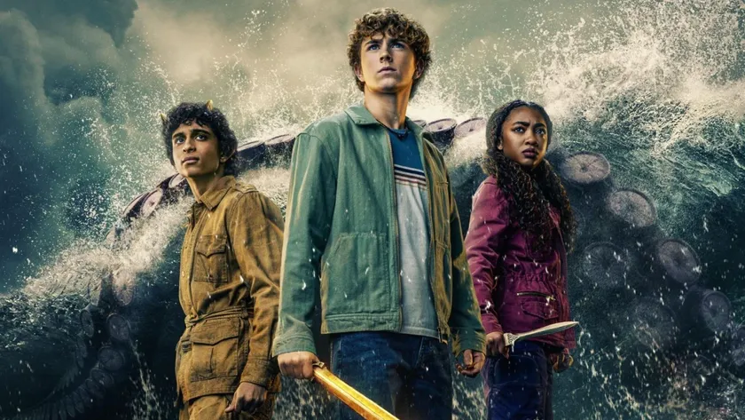 Walker Scobell, Leah Sava Jeffries and Aryan Simhadri in a promotional image for Percy Jackson and the Olympians, with water and a large tentacle behind them.