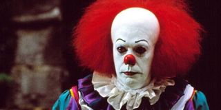 Tim Curry as Pennywise in IT TV miniseries