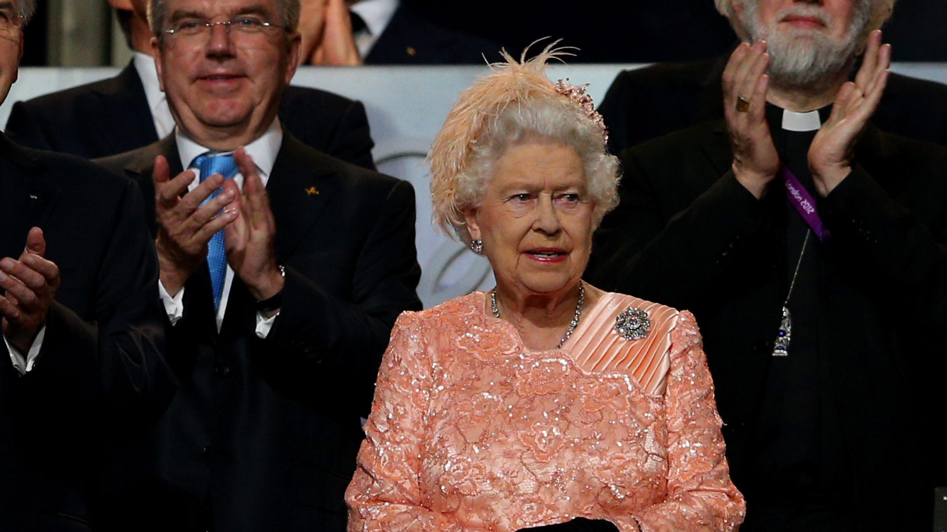 Queen Elizabeth wearing a peach dress at the 2012 Olympics