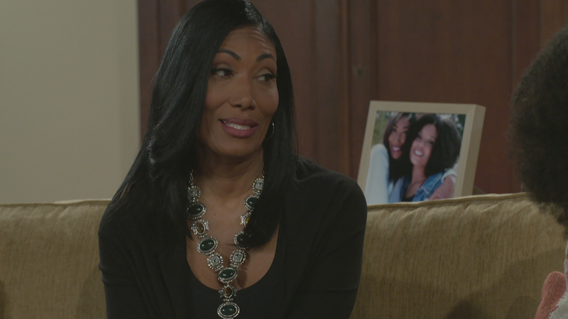 Trisha Mann-Grant as Leslie smirking in Beyond the Gates