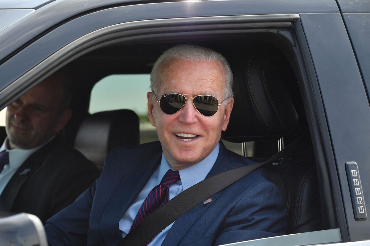 US President Joe Biden talks to the media after driving the new electric Ford F-150 Lightning at the Ford Dearborn Development Center in Dearborn, Michigan on May 18, 2021.