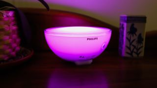 Philips Hue Go 2 on table in pink light