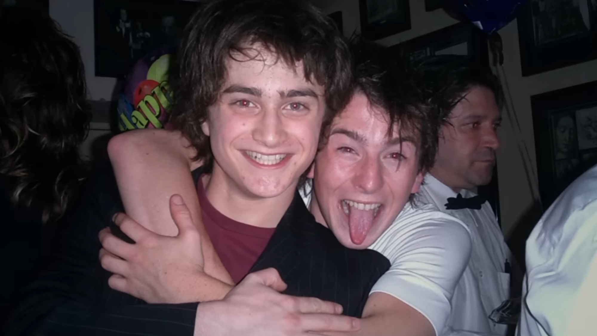 An old image of Daniel Radcliffe and David Holmes is shown in the documentary David Holmes: The Boy Who Lived.