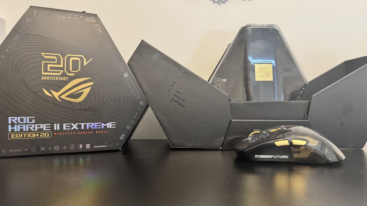 Asus ROG Harpe II Extreme Edition 20 on a table, next to its box and display case