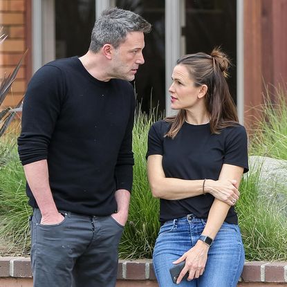 Ben Affleck and Jennifer Garner wearing black shirts and jeans talking in Los Angeles