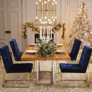 glamorous Christmas table centerpiece with decorated candelabra by Jonathan Adler